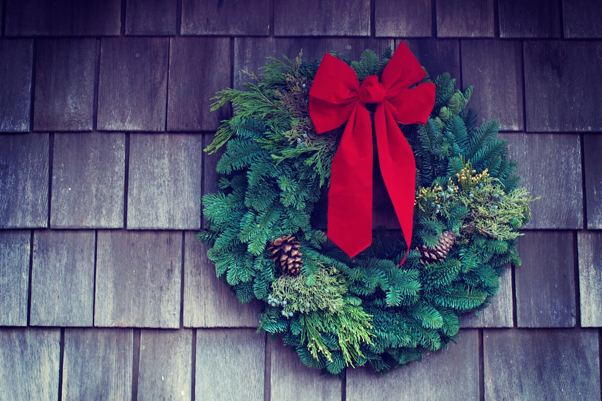 Fresh holiday wreath with a red bow, the kind sold in winter team fundraisers